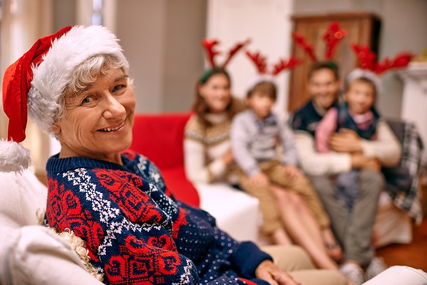 A happy grandmother with her family on Christmas Eve