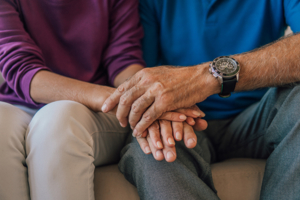 Mature couple holding hands