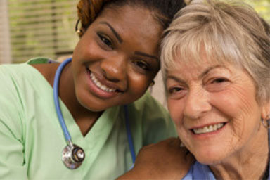 Caregiver and client smiling