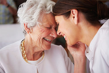 Client and caregiver smiling