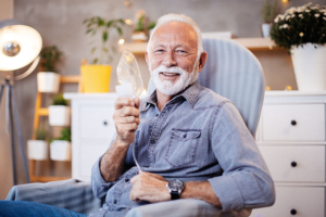 happy-senior-man-holding-oxygen-mask-with-copd
