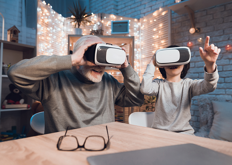 grandfather and grandchild using virtual reality headsets