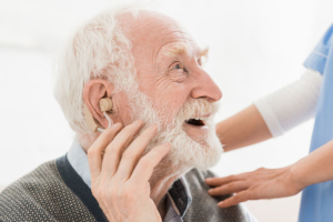 Senior man wearing a hearing aide