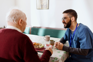 Home caretaker – man helping senior man