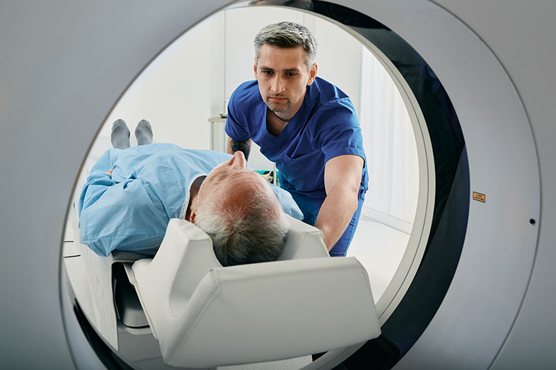 senior-man-getting-ct-scan-with-technician