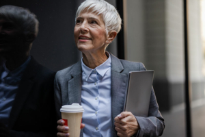 A businesswoman smiles as she understands that you don’t have to sacrifice your career while caring for your parents.